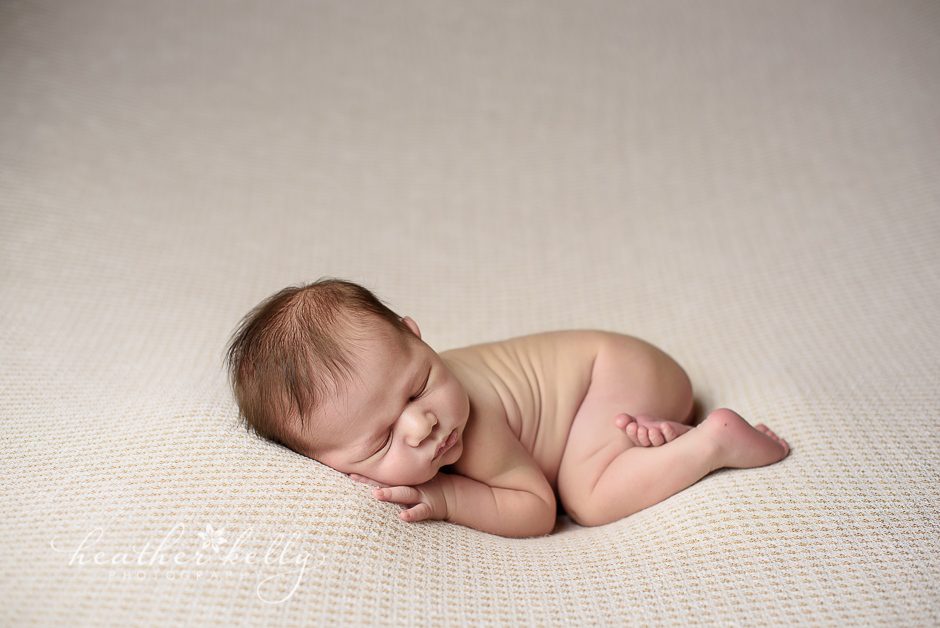 naked newborn photography pose