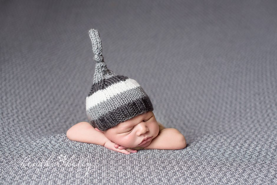 baby boy with gray hat