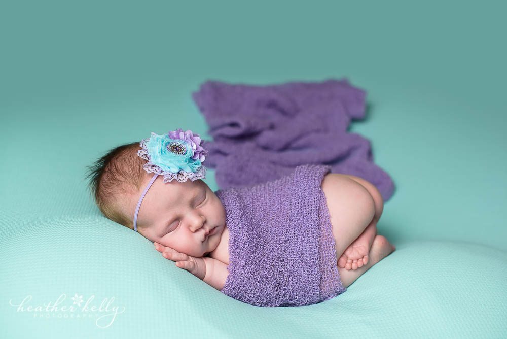 aqua and purple baby girl with professional newborn photographer