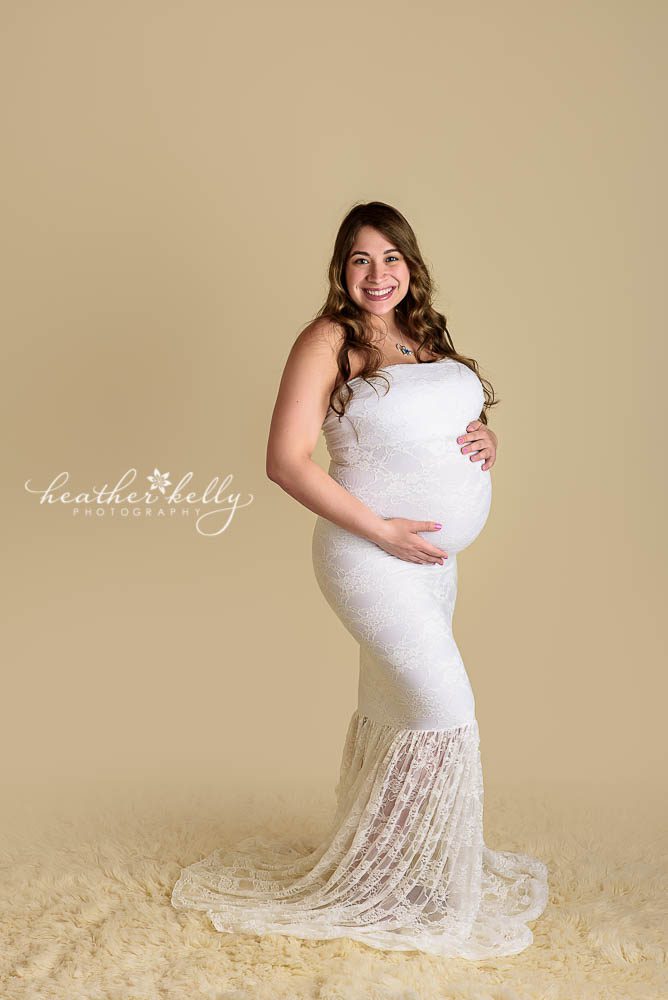 studio maternity image with white gown