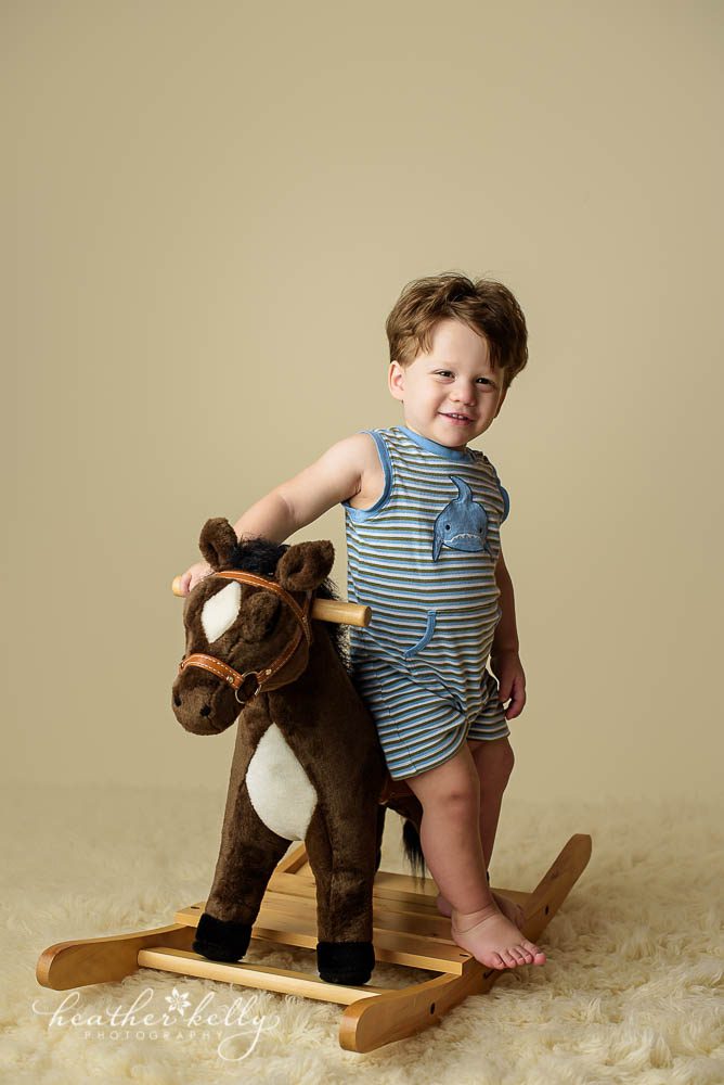 17 month old boy on toy horse