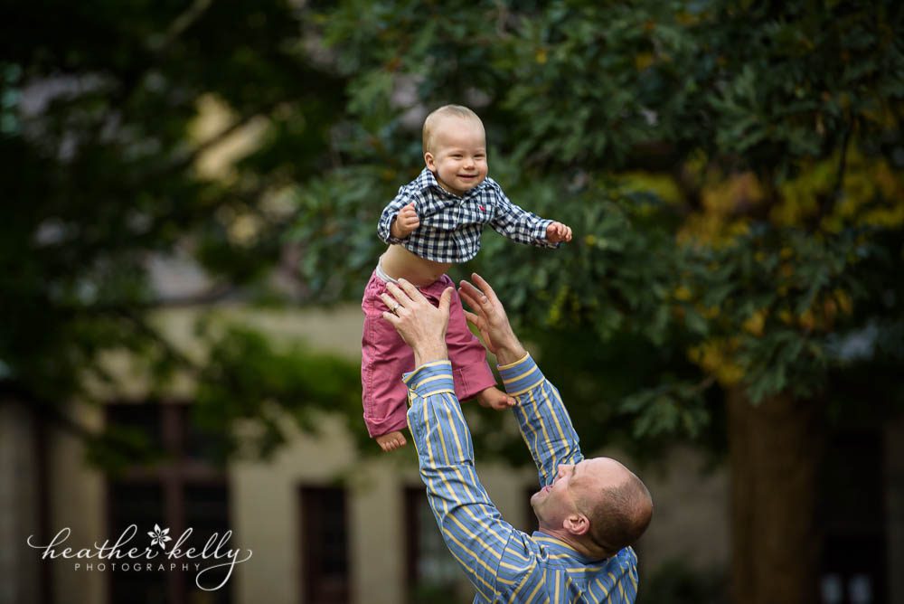 dad throwing one year old in air