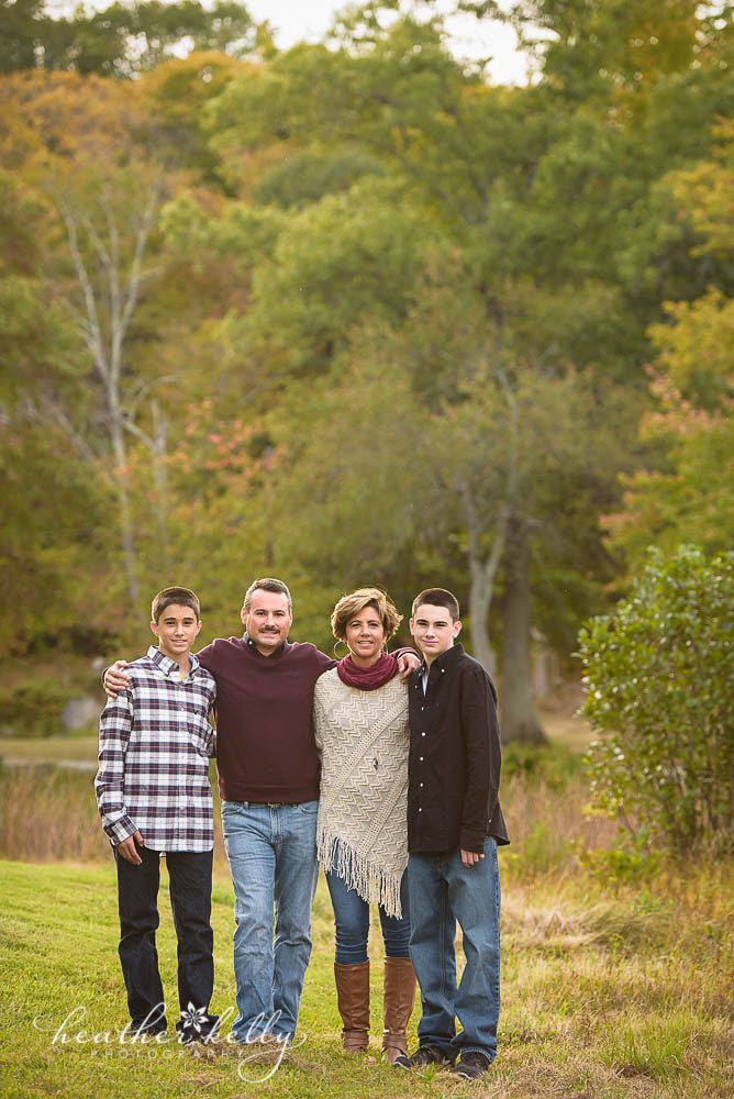 family pose with teenage boys