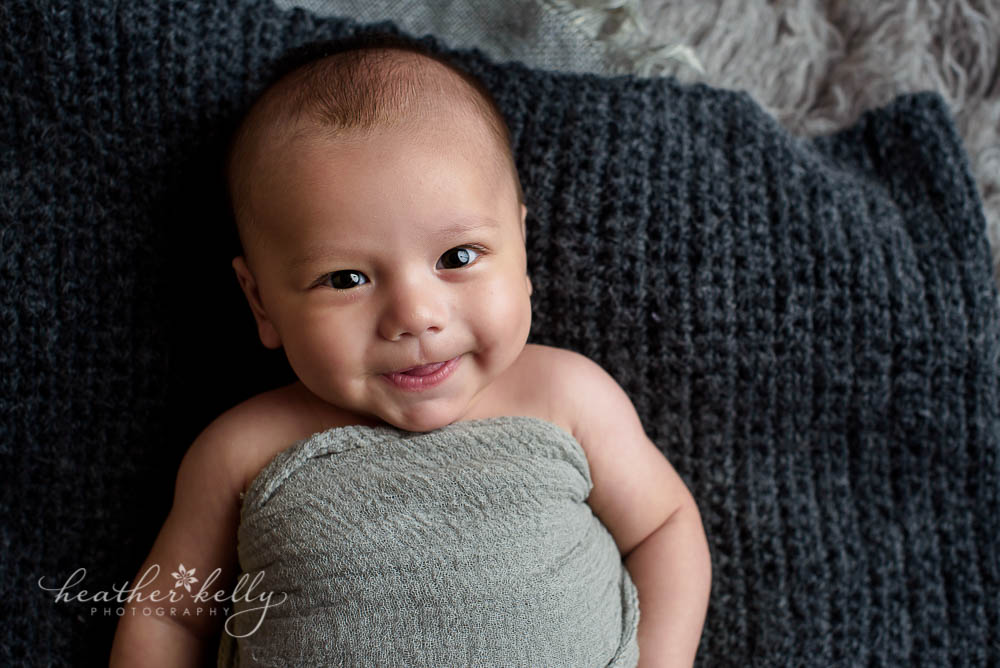 baby photography 3 month baby boy in gray wrap on rug