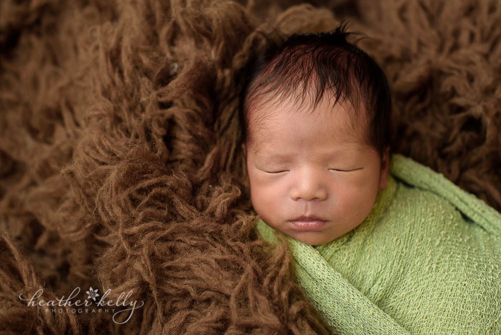 nowalk ct newborn boy wrapped in green photo