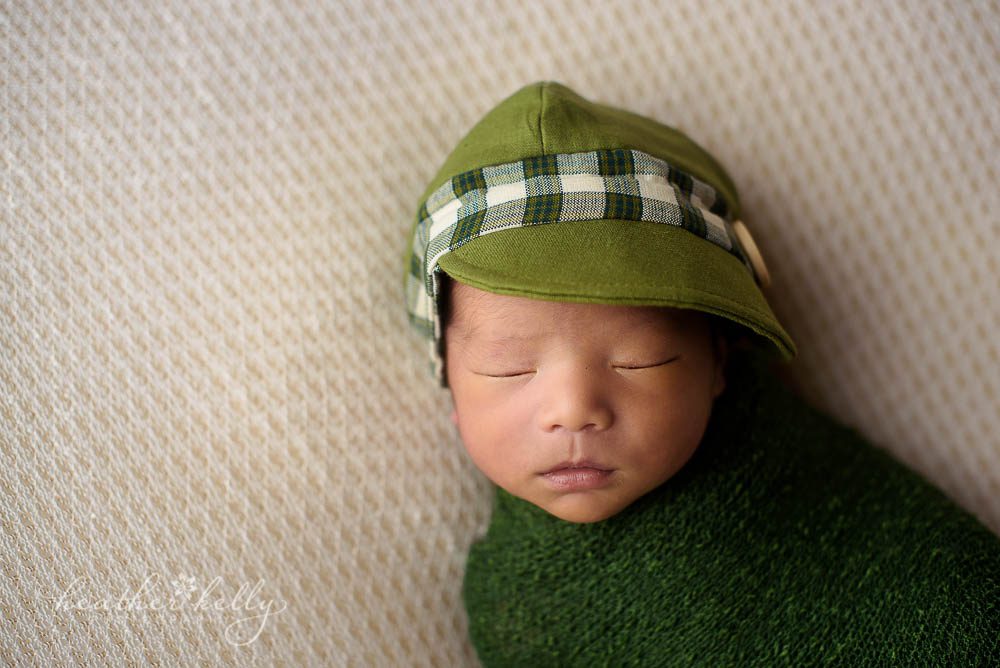 norwalk ct newborn boy with green cap and wrap photo so cute!