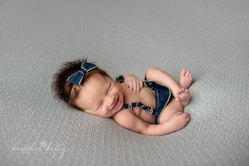 Newtown newborn smiling newborn photo of baby girl by ct newborn photographer Heather Kelly Photography
