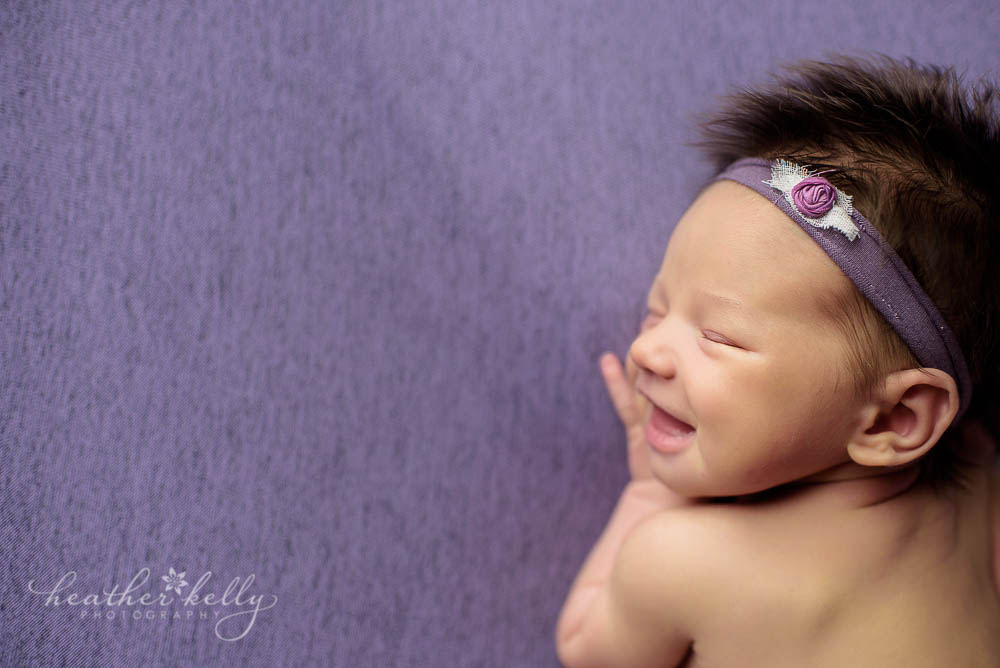 newtown newborn profile photo of smiling newborn girl