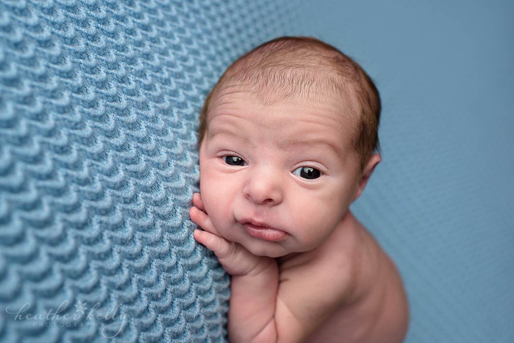 adorable newborn boy awake on bean bag norwalk newborn photography ct