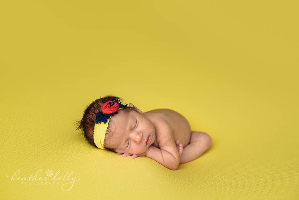 bright yellow newborn backdrop for disney inspired photography. newtown ct twins