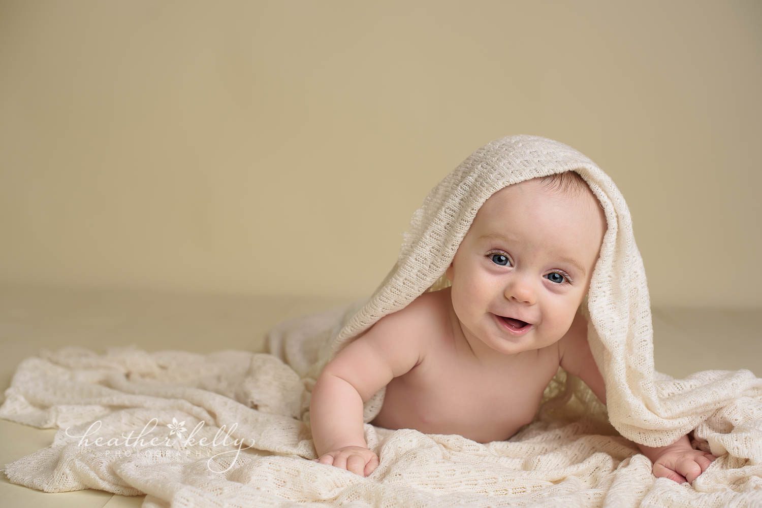 7 month baby boy with cream blanket on his head photo. newtown baby boy by ct photographer heather kelly photography
