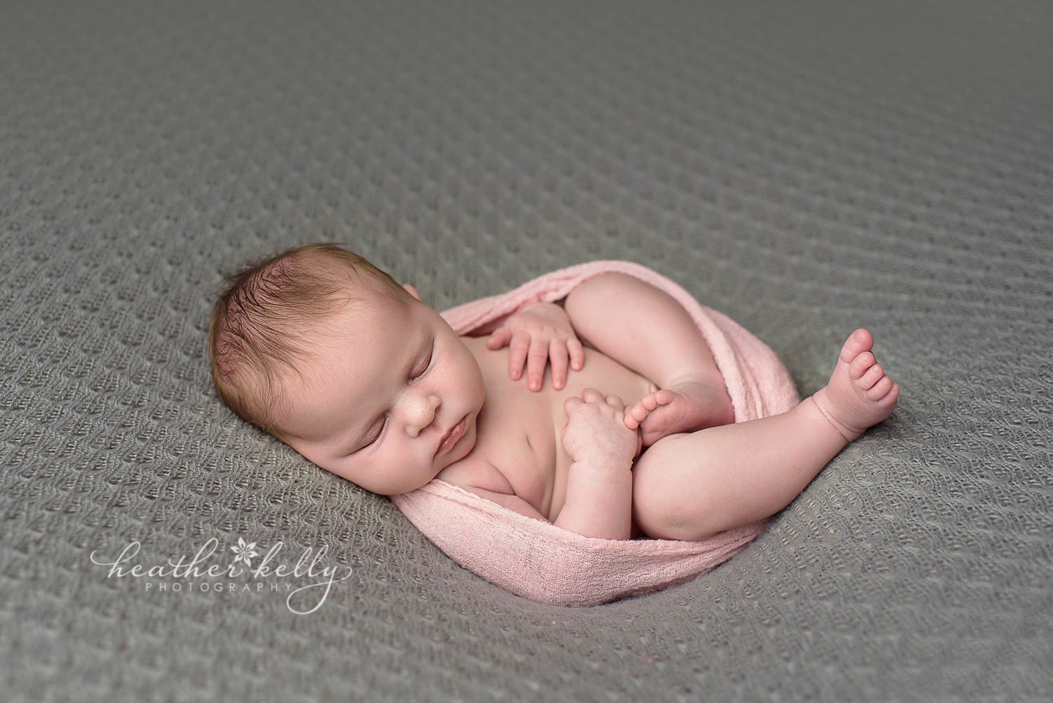 newborn photography pose on back with pink wrap and gray backdrop.  easton newborn photos. ct newborn photography by heather kelly photography. 