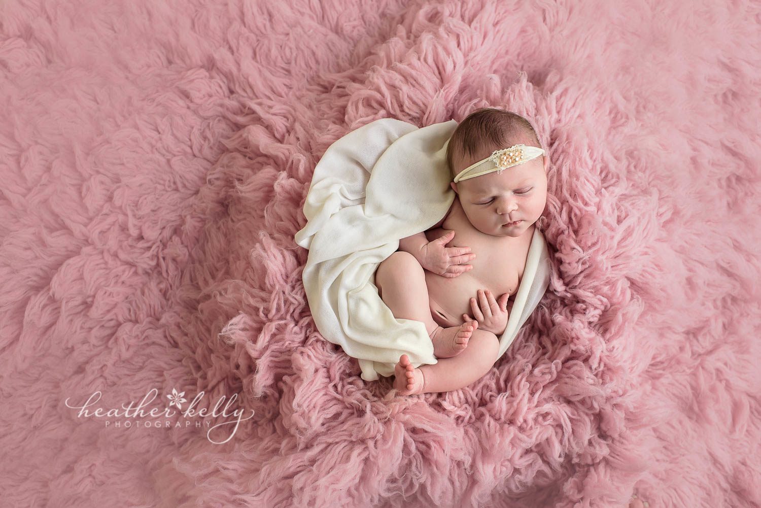 newborn photography. baby girl on pink flokati with cream wrap. easton newborn photos. ct newborn photography.