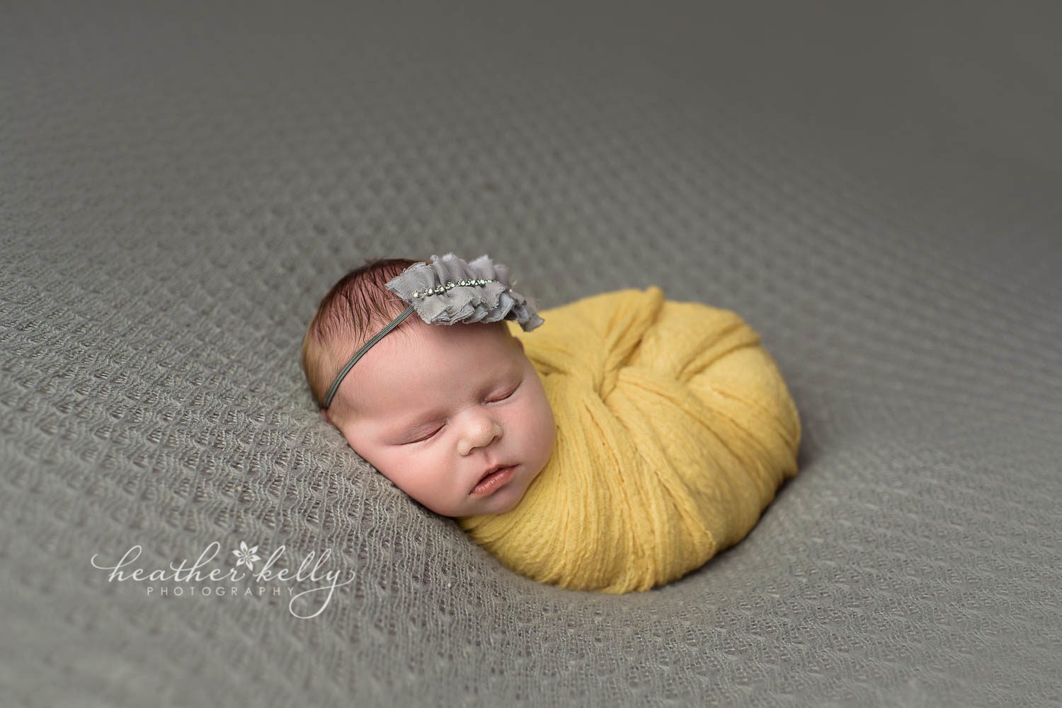 newborn photography. yellow twist wrap on gray backdrop. ct newborn photography. easton newborn photos. 