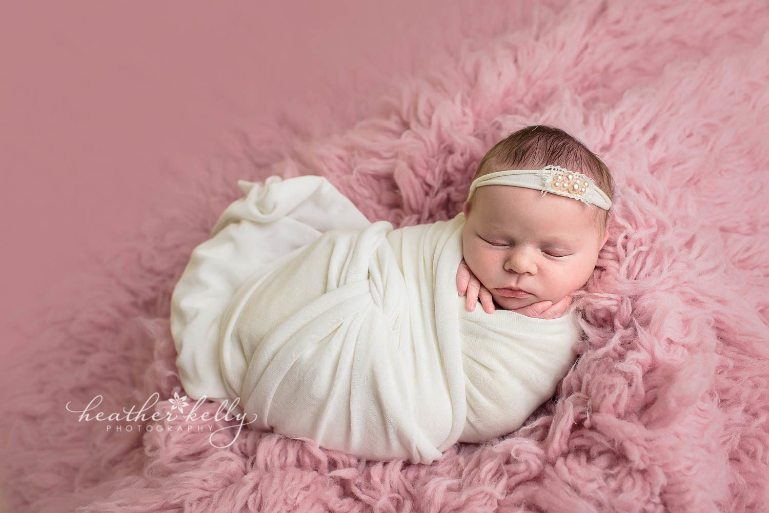 newborn photography poses. baby girl wrapped in cream on pink flokati. easton newborn photography. ct newborn photographer. 
