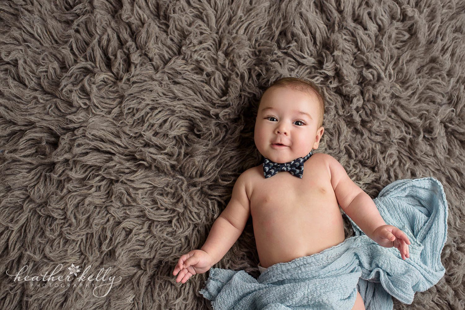 4 month baby boy with bow tie and blue wrap on gray rug photo. sandy hook ct baby photography