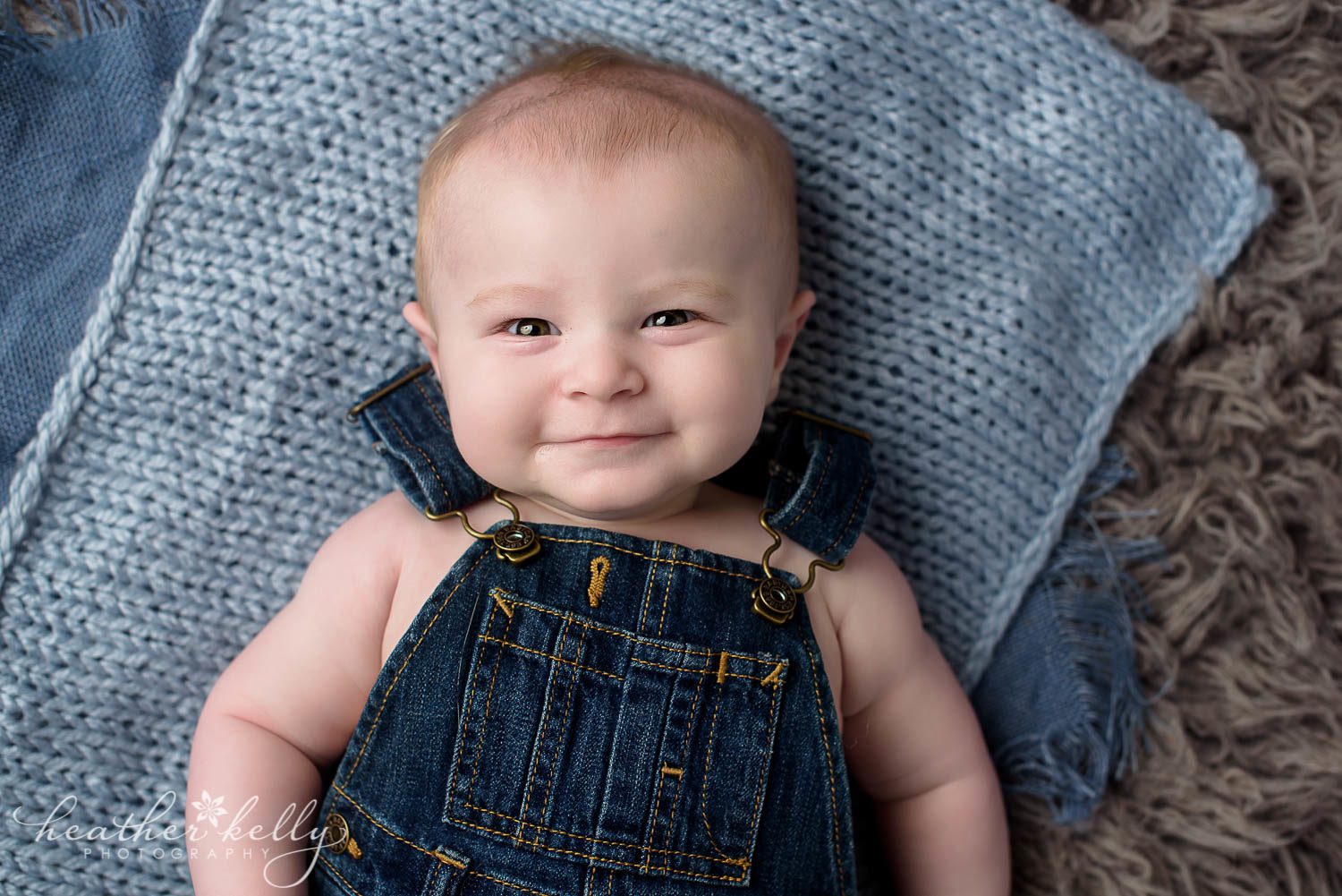 light blue, overalls, and gray backdrop photo of 6 month danbury baby boy