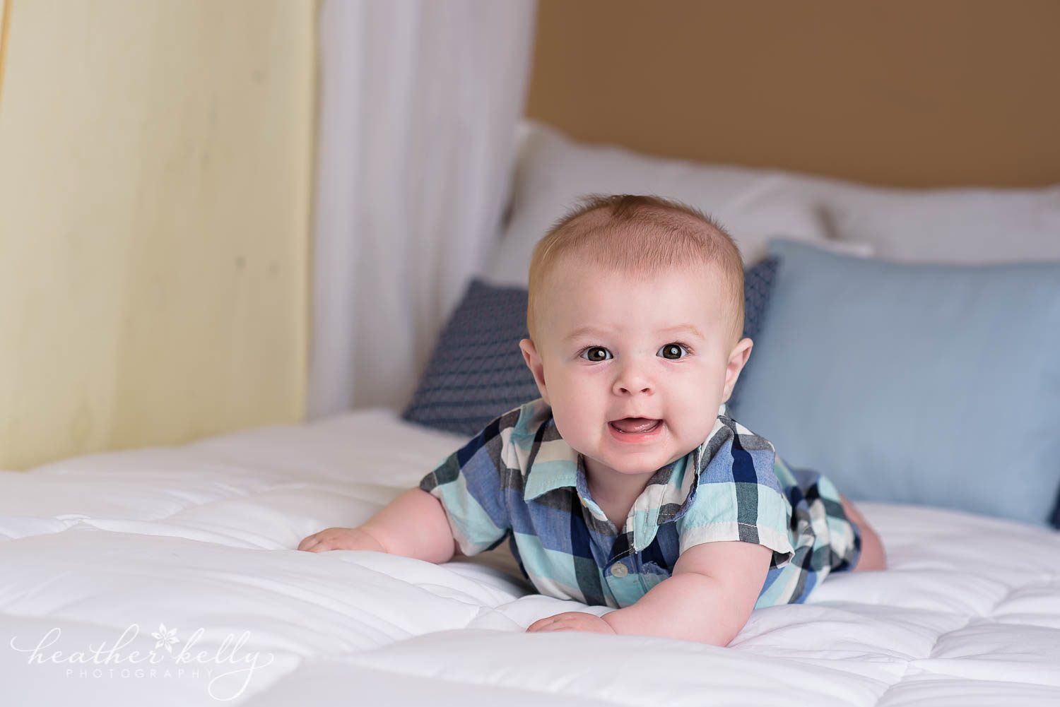 photo of 6 month baby boy laying on bed. danbury baby boy