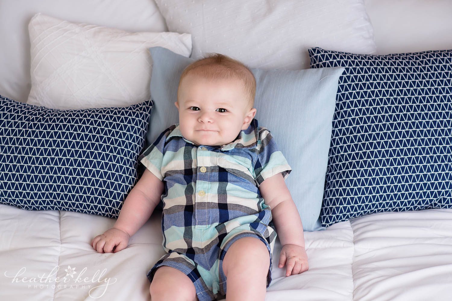 baby boy in blue on white bed set up  photo. danbury baby boy