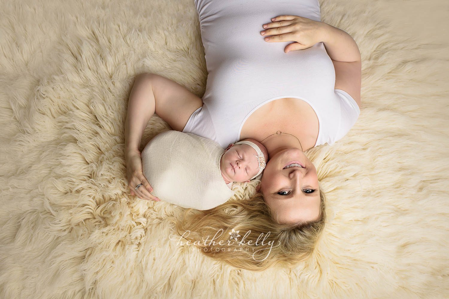 mom and newborn girl laying on rug photo. trumbull ct newborn photography