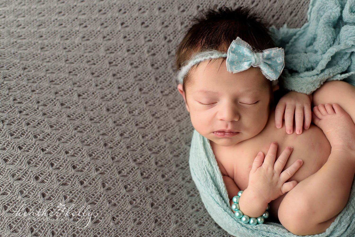 newborn photography. Newborn girl with blue wrap and bracelet. monroe ct newborn photography