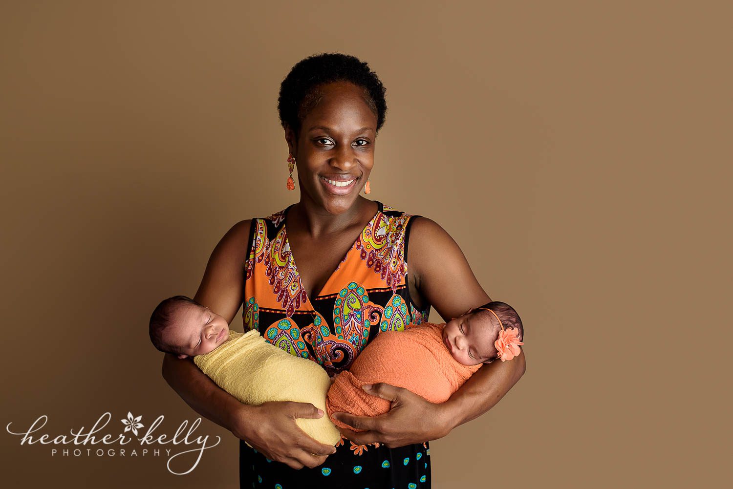 mom holding newborn twins east hartford ct newborn photographer