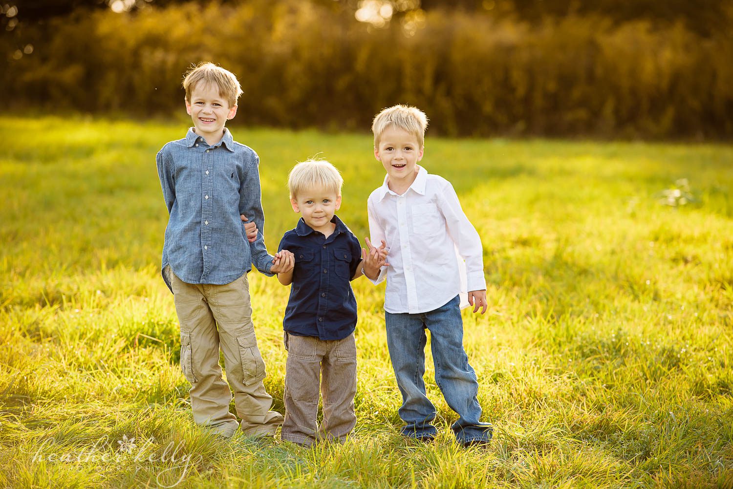 three brothers holding hands. ct family photography. now booking spring 2017 family sessions in ct.