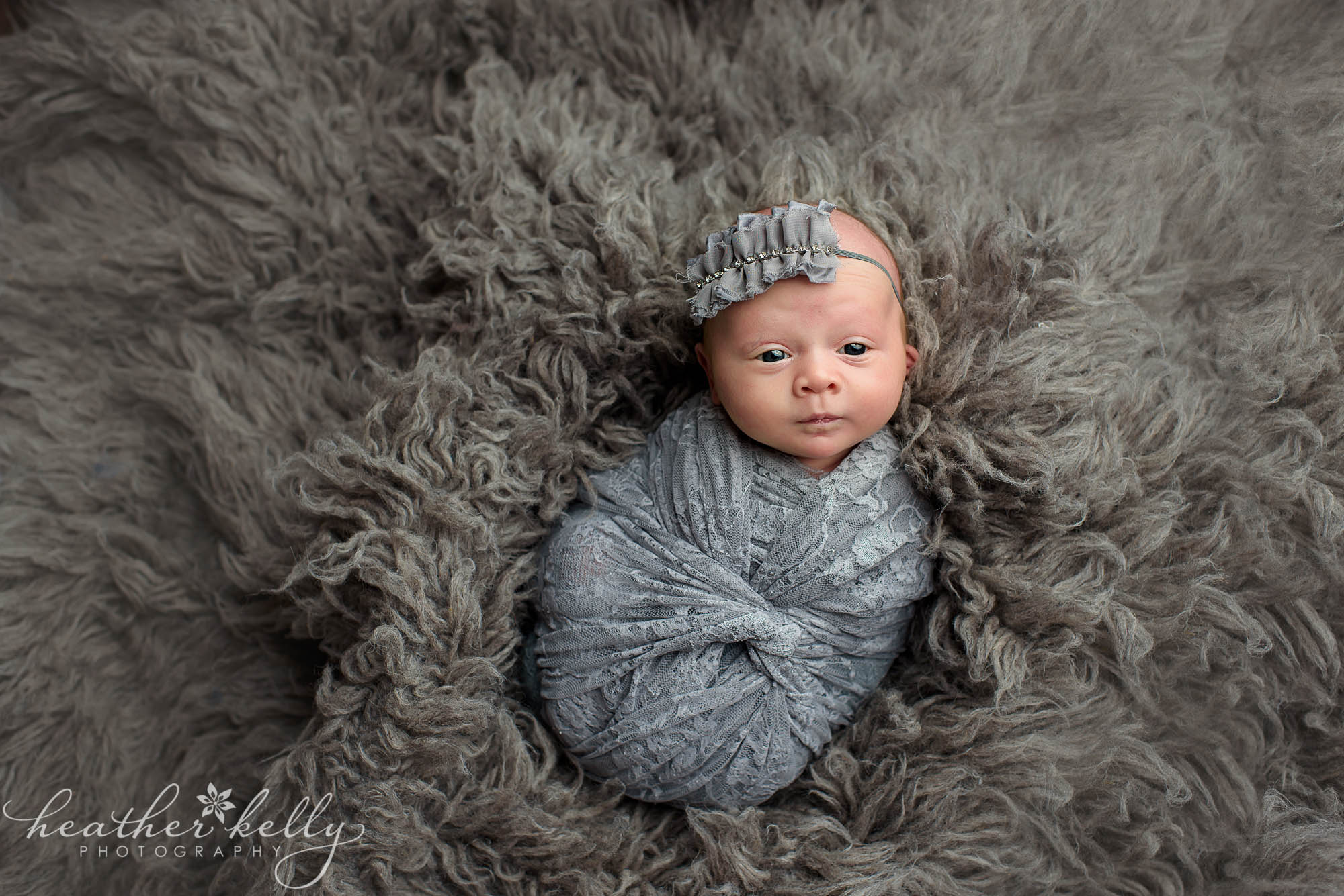 awake newborn girl wrapped in gray. west hartford newborn ct photography