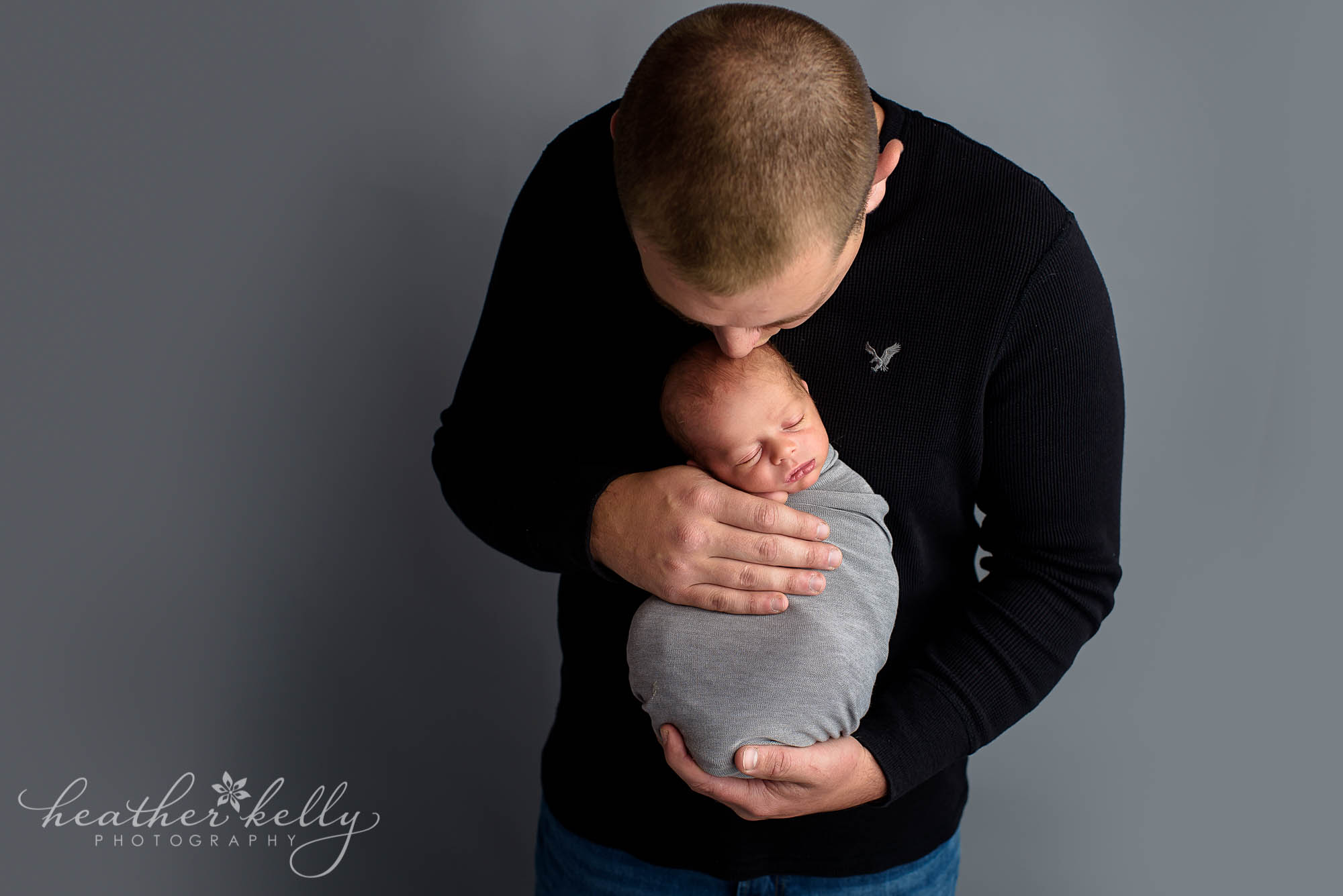 dad kissing newborn son. southbury newborn ct photography
