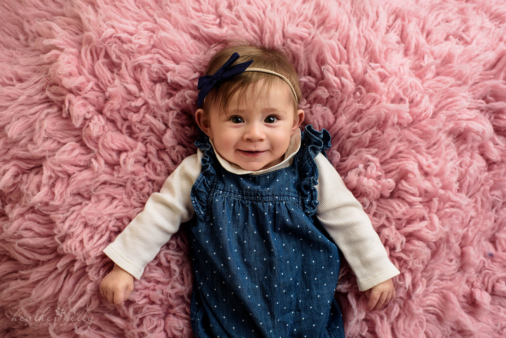 6 month photo session. baby girl on pink flokati. monroe baby photography