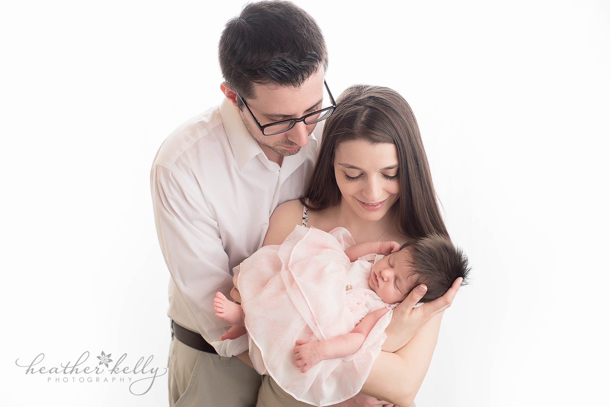 mom and dad with newborn daughter. stratford newborn photography