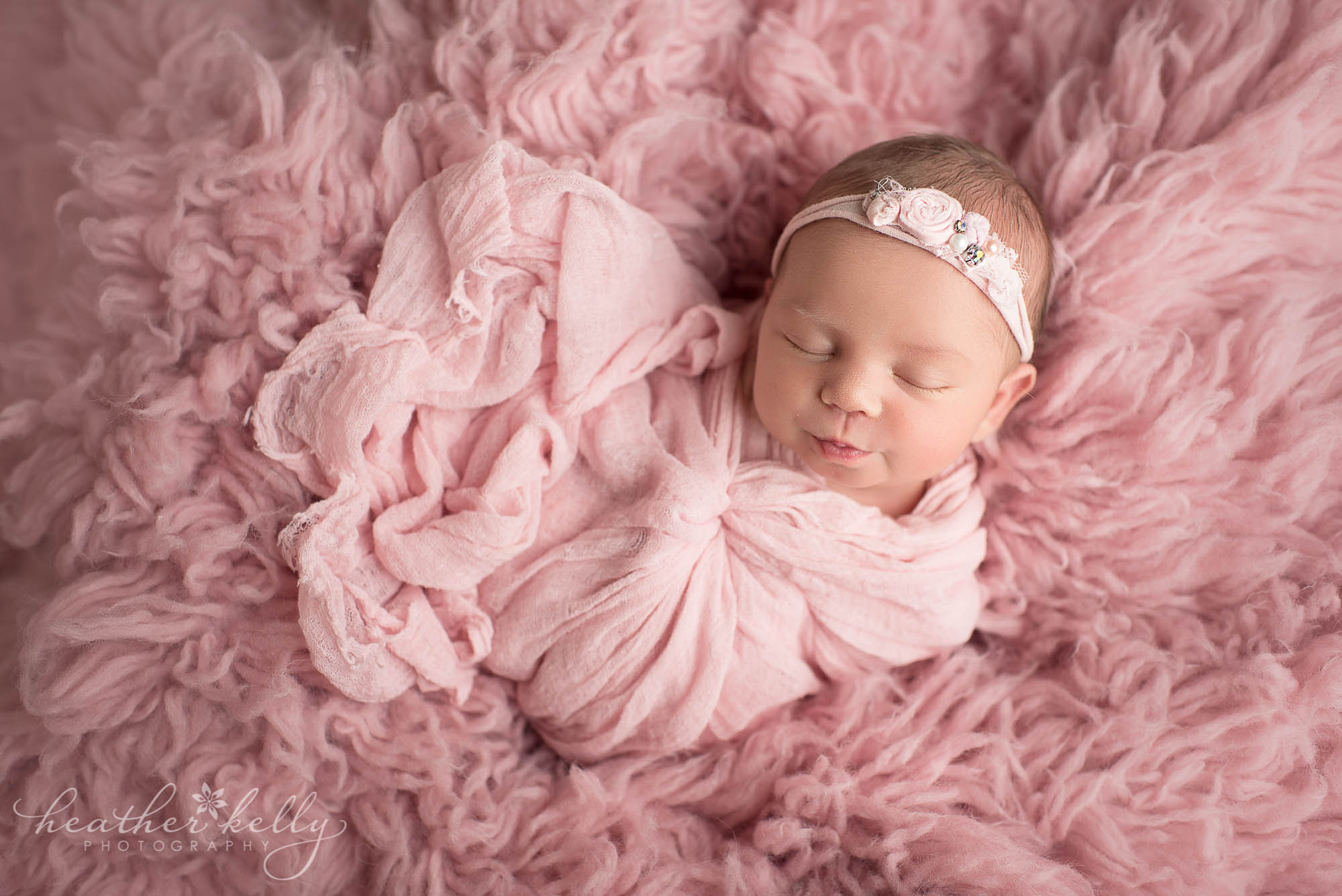 baby girl wrapped in pink. ct newborn photographer