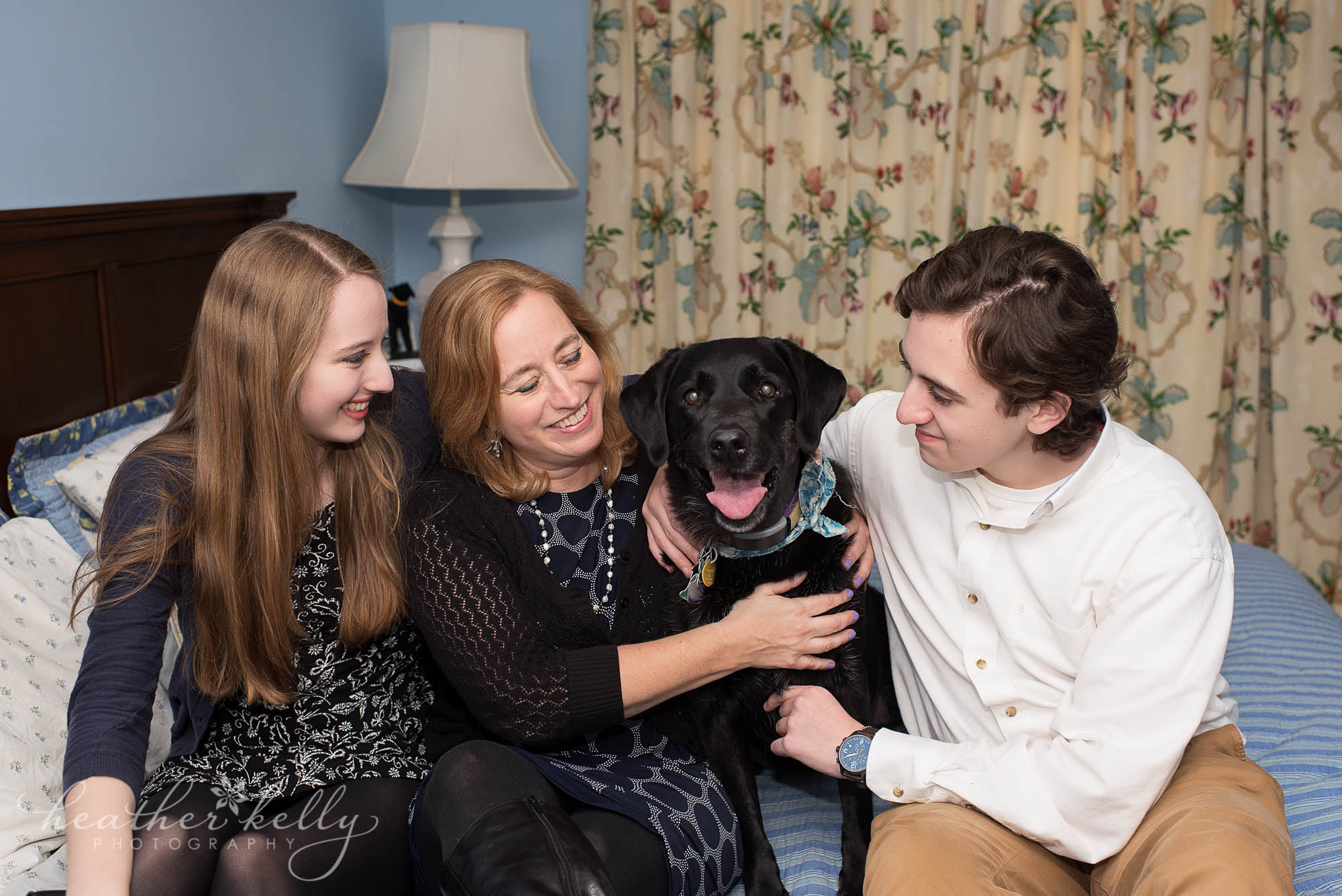 family with their black lab