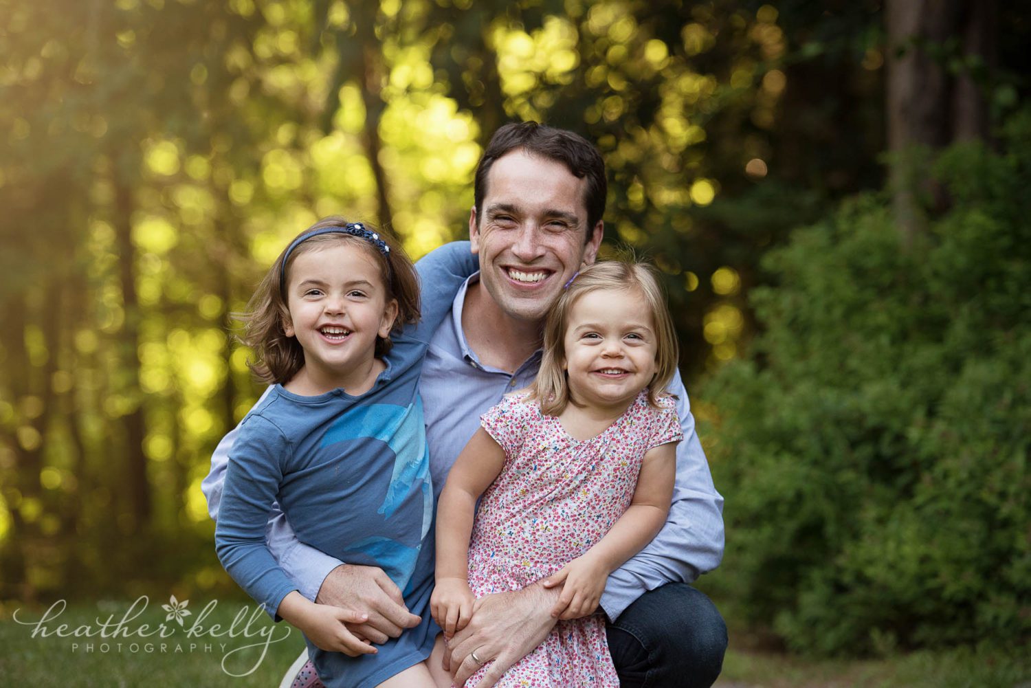 dad and his daughters smiling. New milford CT family photography. 