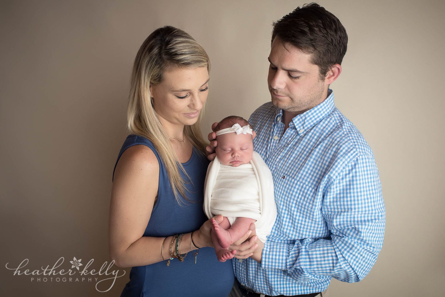 shelton newborn photography. mom and dad posed with their newborn girl. 