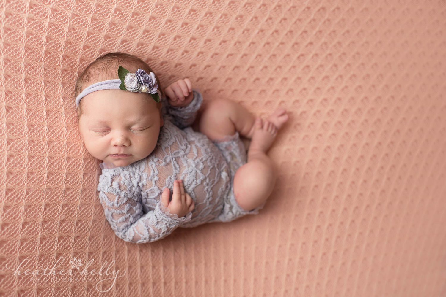 newborn photography shelton ct. Newborn girl on peach and purple. 