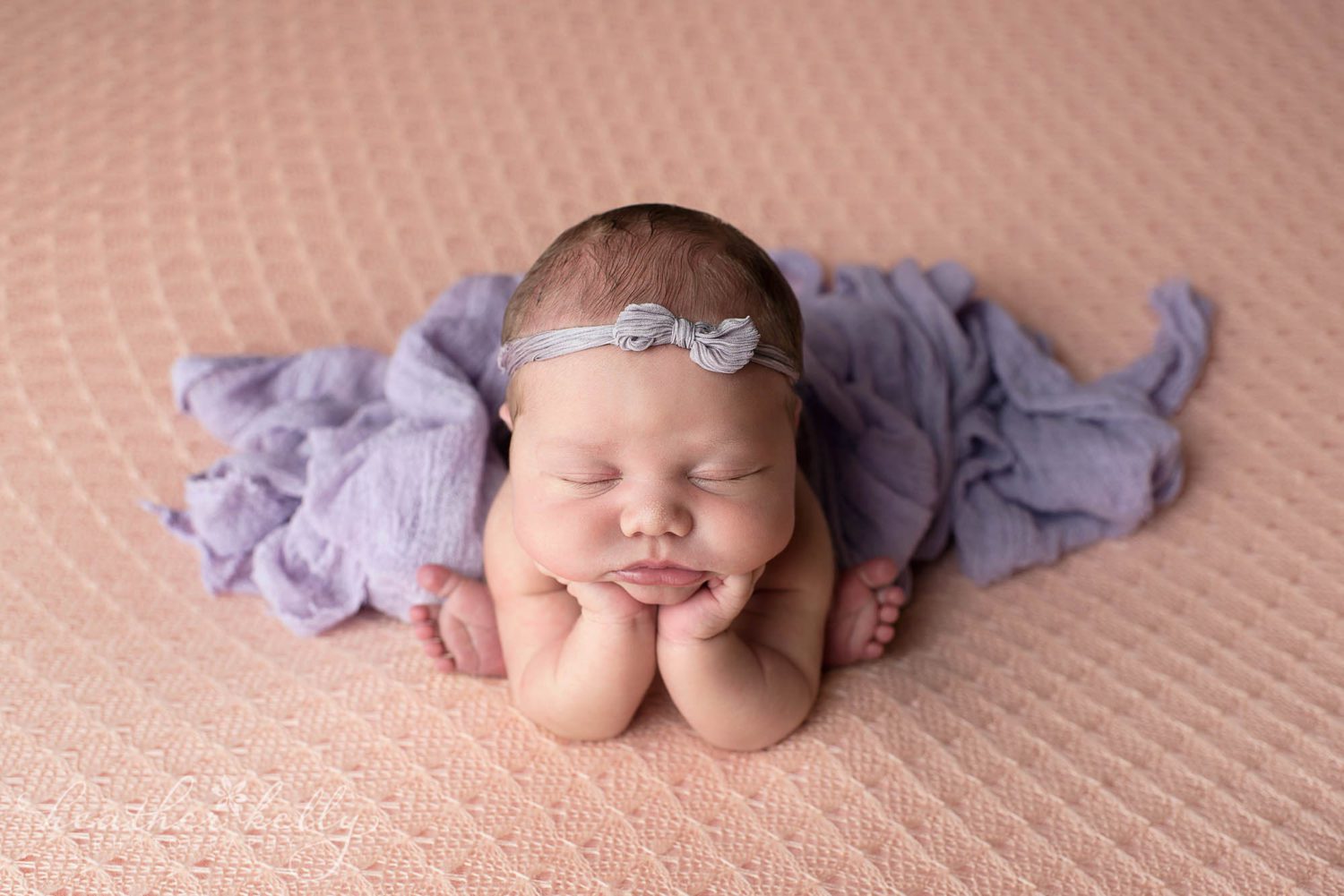 newborn photography ct. peach and purple newborn photography. newborn girl in froggie position. 