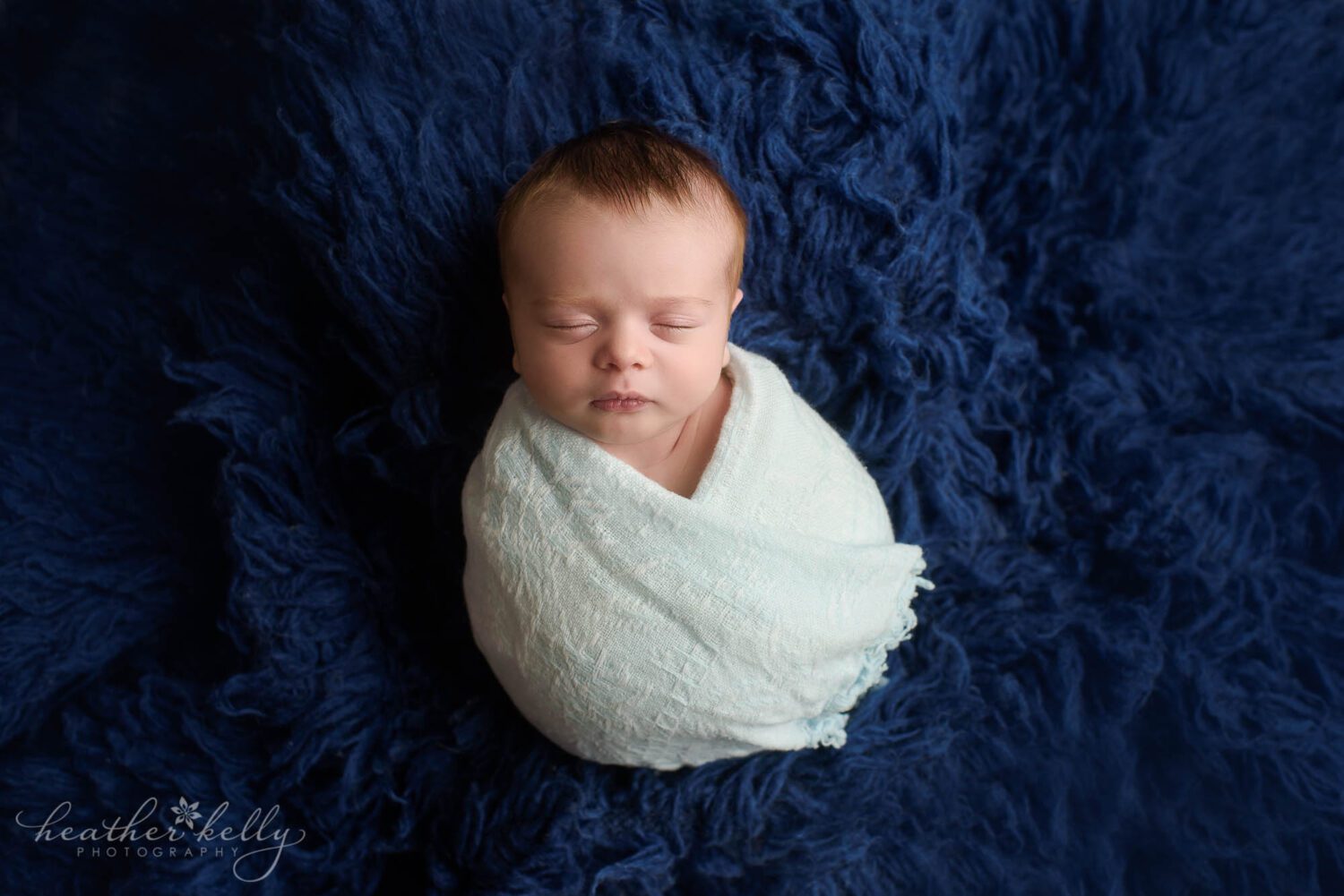 new milford newborn photos

newborn boy wrapped in dad's childhood blanket