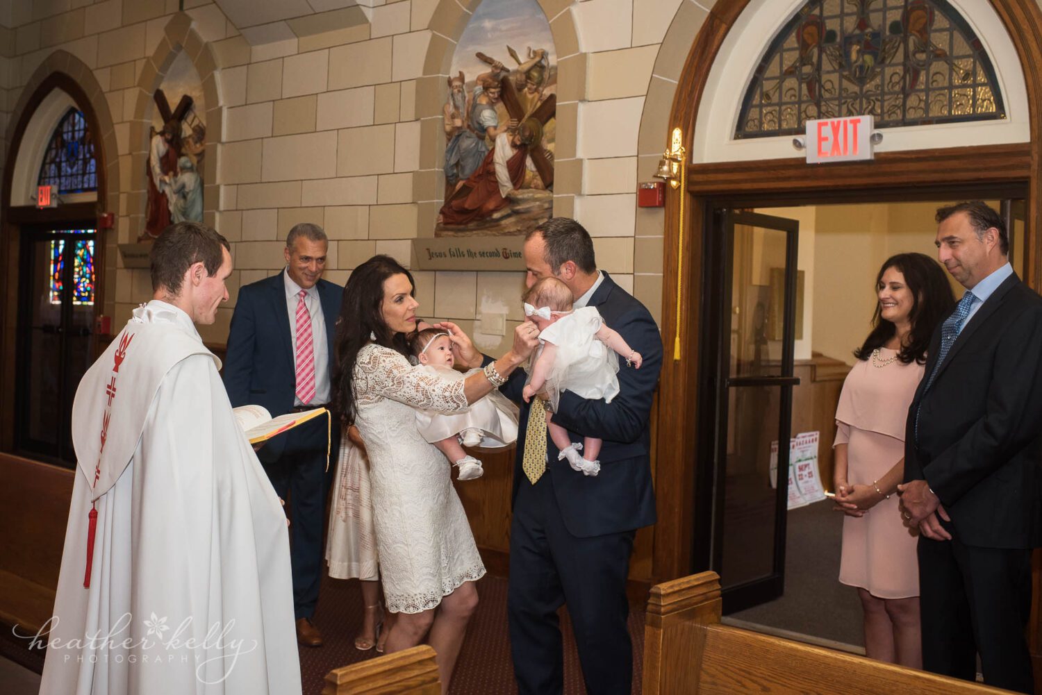 parents holding their twins during their baptism in wallingford ct