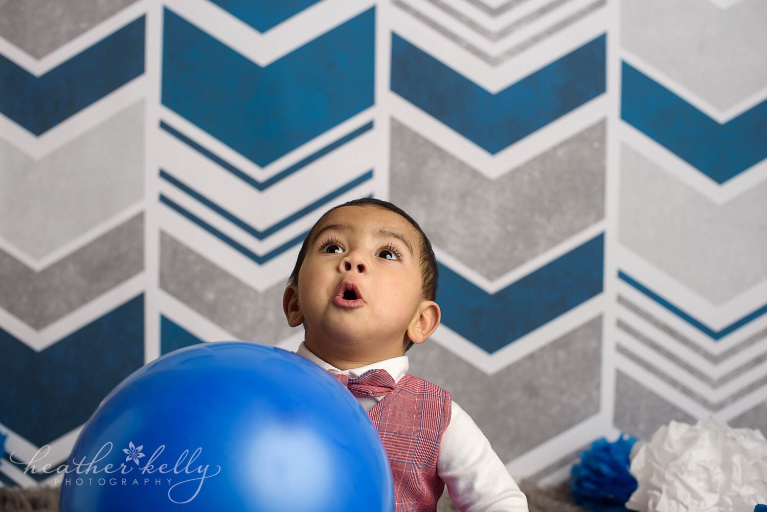 expressive boy at his first birthday cake smash session in southbury ct