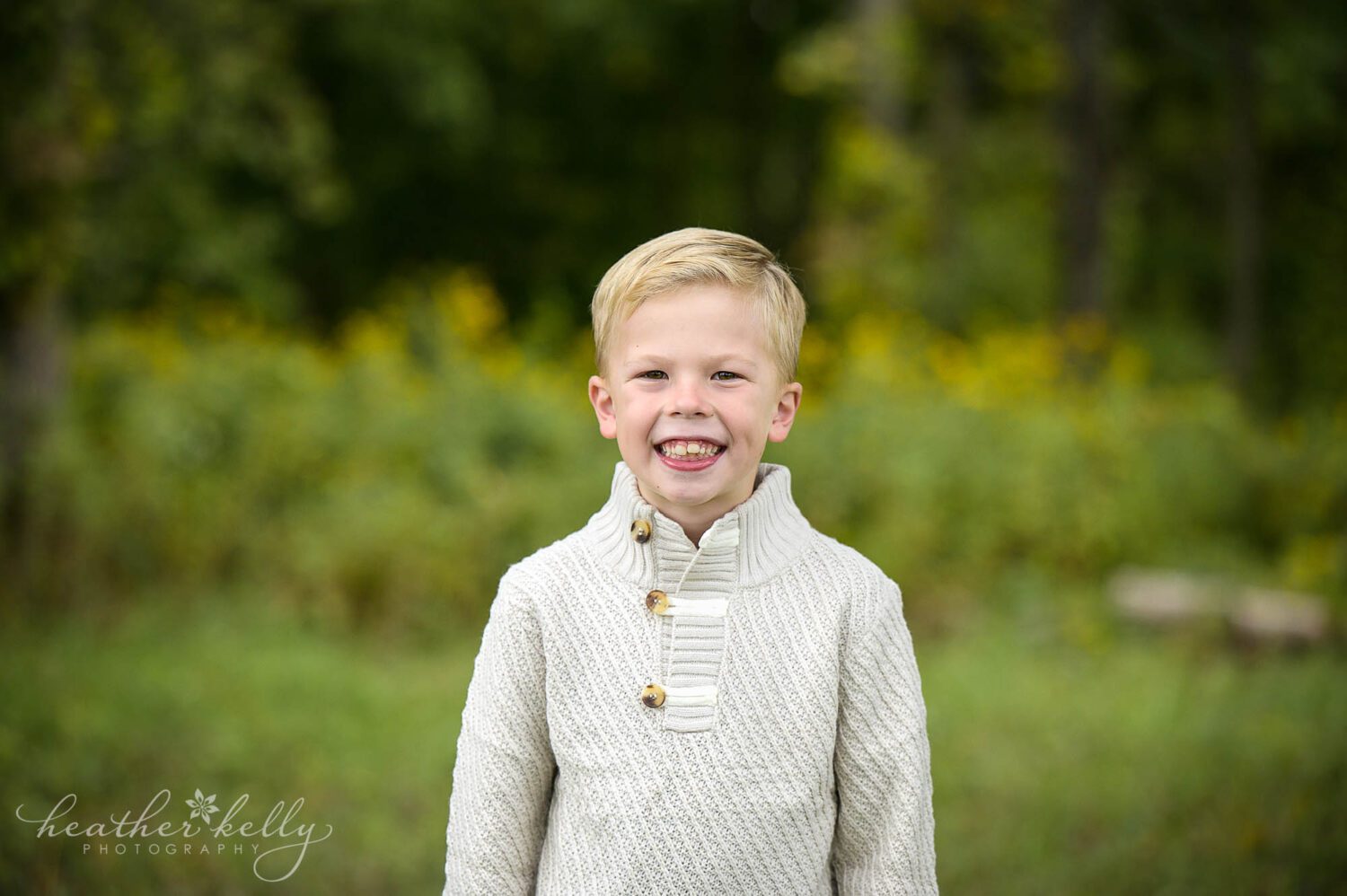 a Boy poses during his outdoor family photography session in CT 
