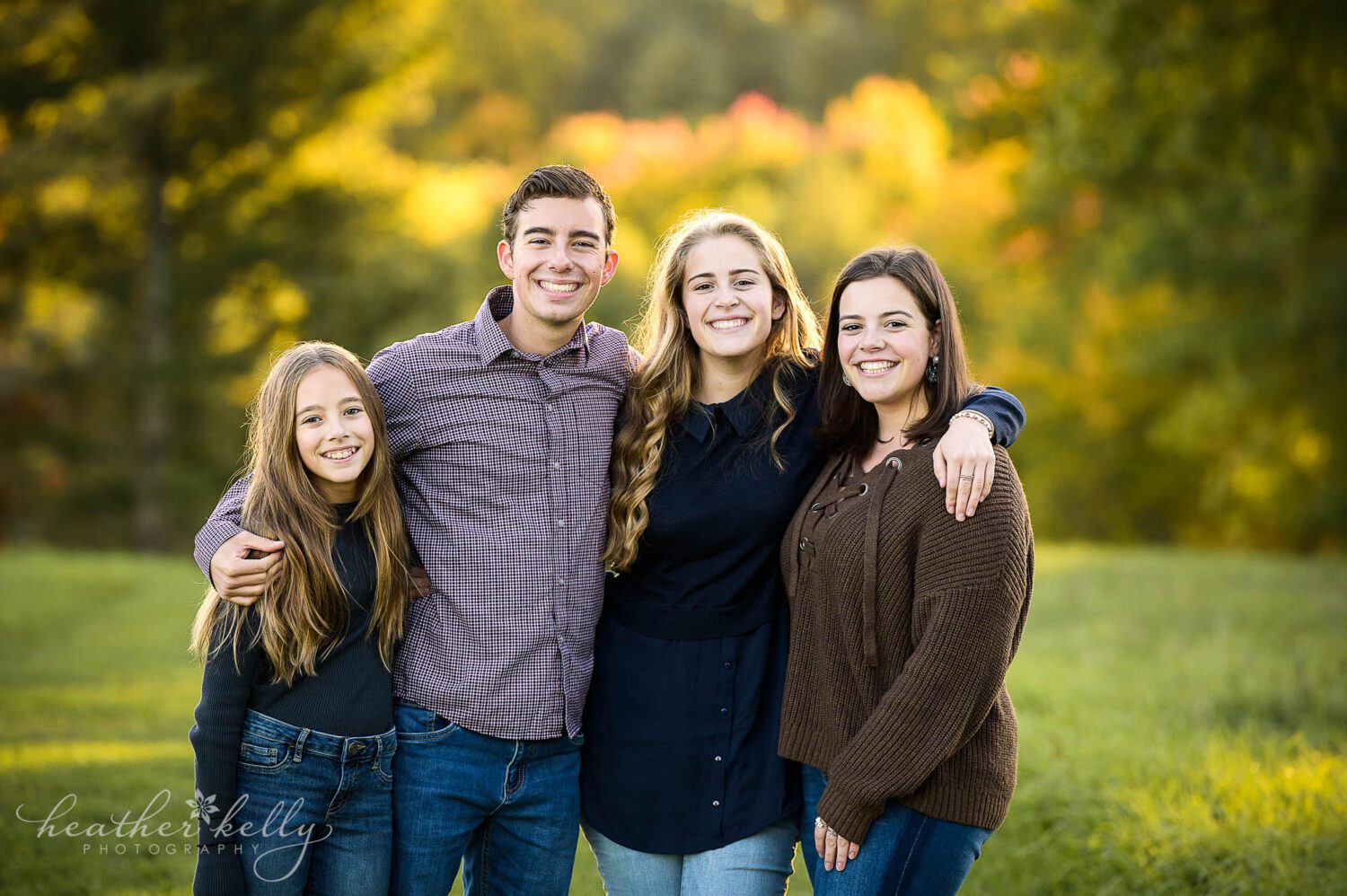 4 siblings pose together for their sandy hook ct portrait session. 